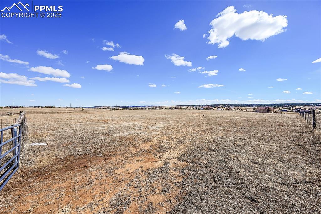 Image 15 of 32: View of yard with a rural view