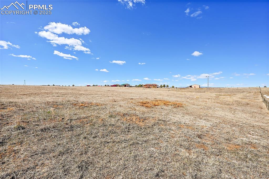 Image 17 of 32: View of yard with a rural view