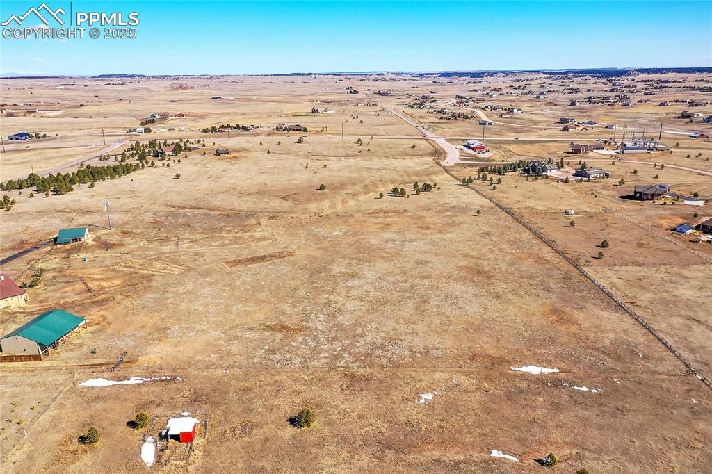 Image 2 of 32: Drone / aerial view with a rural view and view of desert