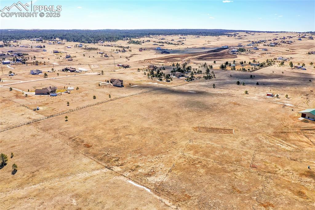 Image 26 of 32: Drone / aerial view with view of desert and a rural view