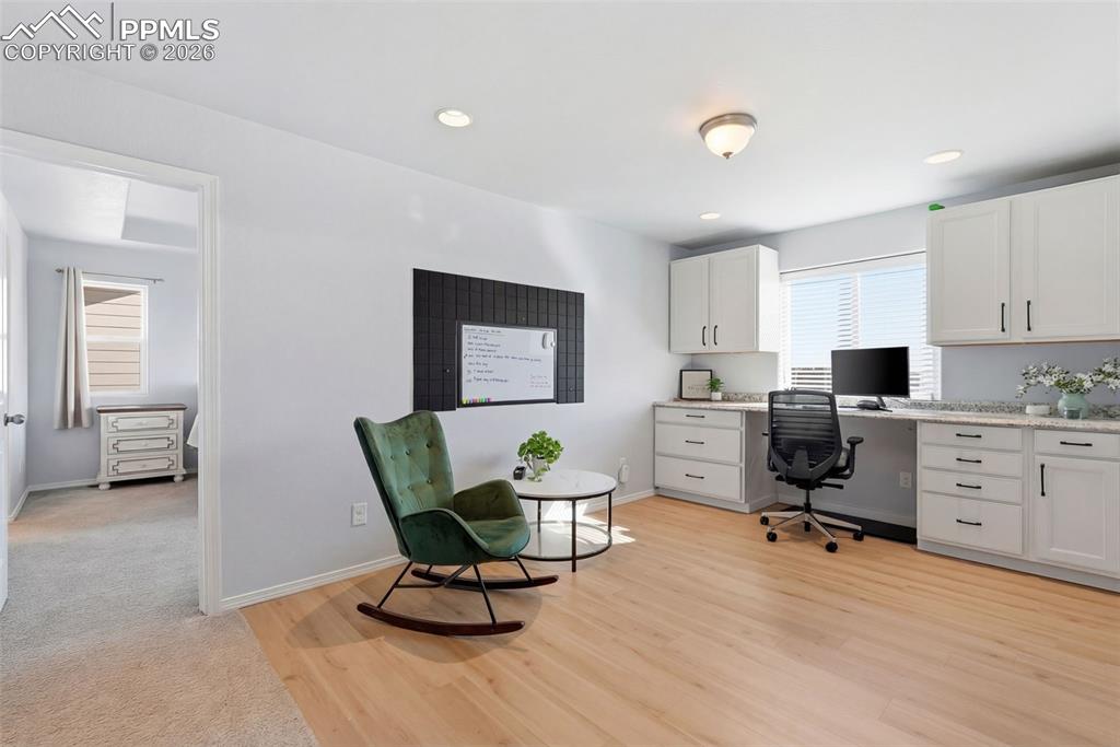 Image 17 of 33: flex space upstairs with built ins