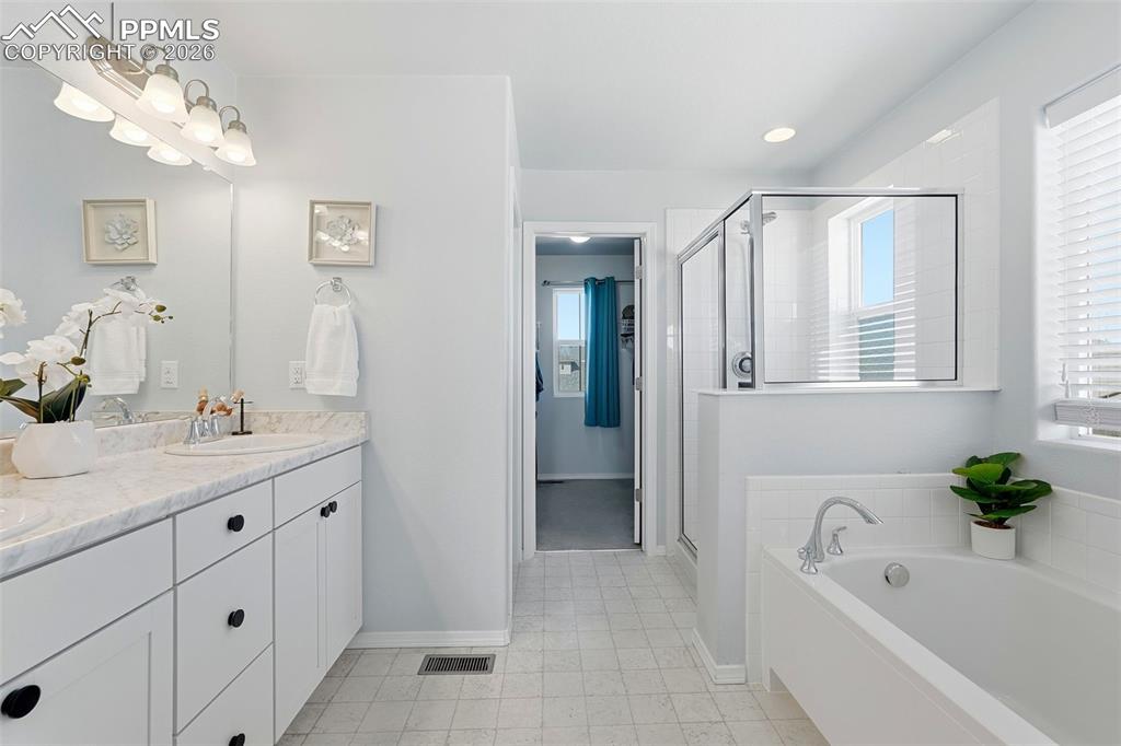 Image 22 of 33: master - tub, shower and walk in closet