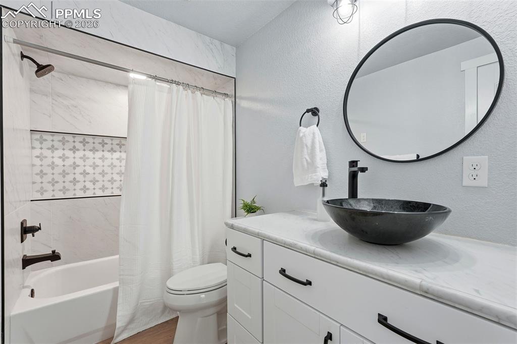 Image 28 of 33: bathroom connected to bedroom in basement