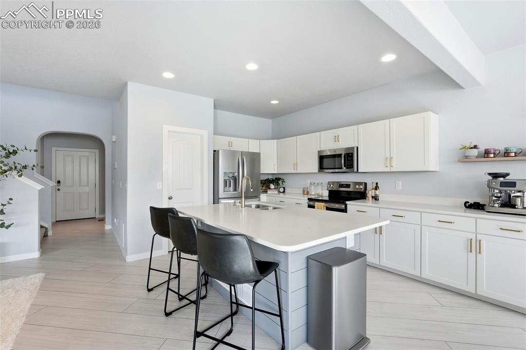 Image 4 of 33: kitchen and entry way