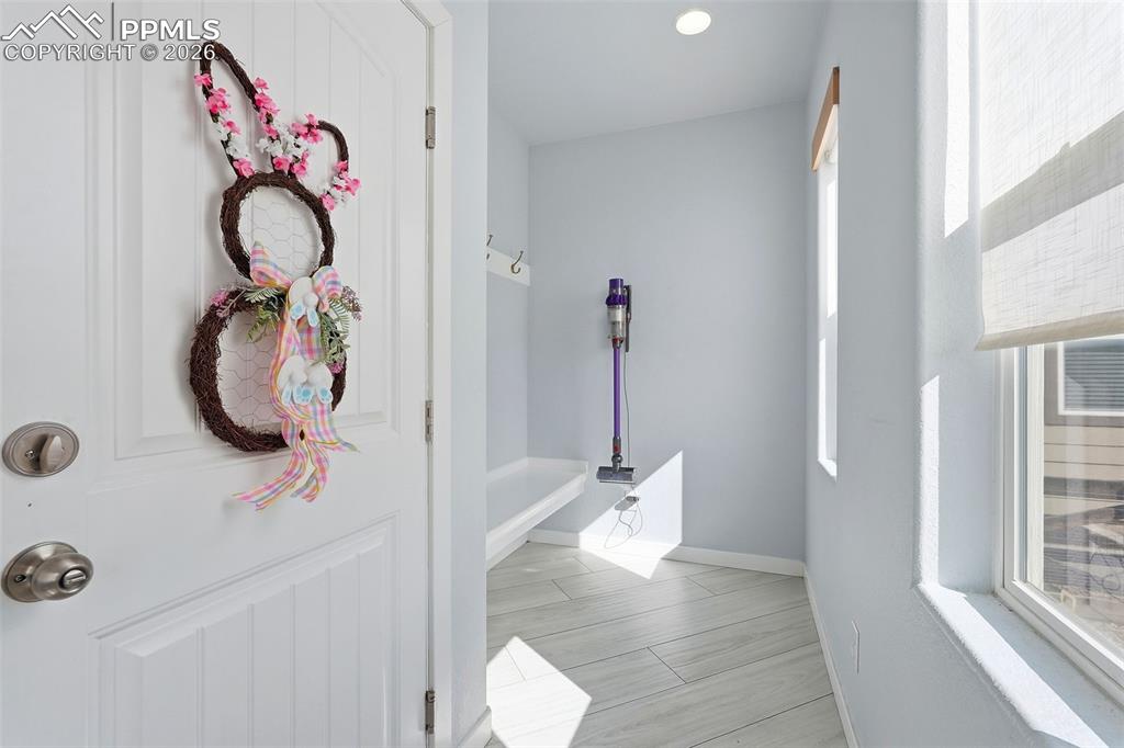 Image 7 of 33: mudroom off kitchen/dining area and connects to the garage
