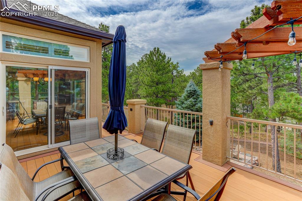 Image 33 of 45: Large composite deck -- eat under a canopy of Ponderosa pines!