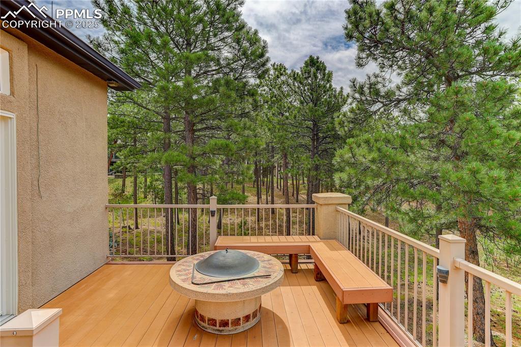 Image 36 of 45: Can you believe the SIZE of this deck? Bench seating and fire pit INCLUDED!