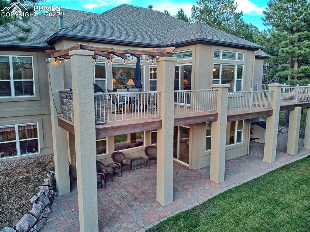 Image 4 of 45: Walk-out ranch with multiple outdoor living areas!