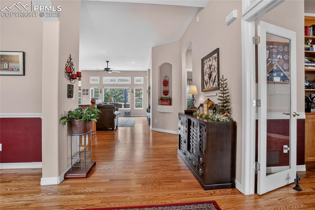 Image 6 of 45: Front entry. Notice the beautiful hardwood floors throughout.