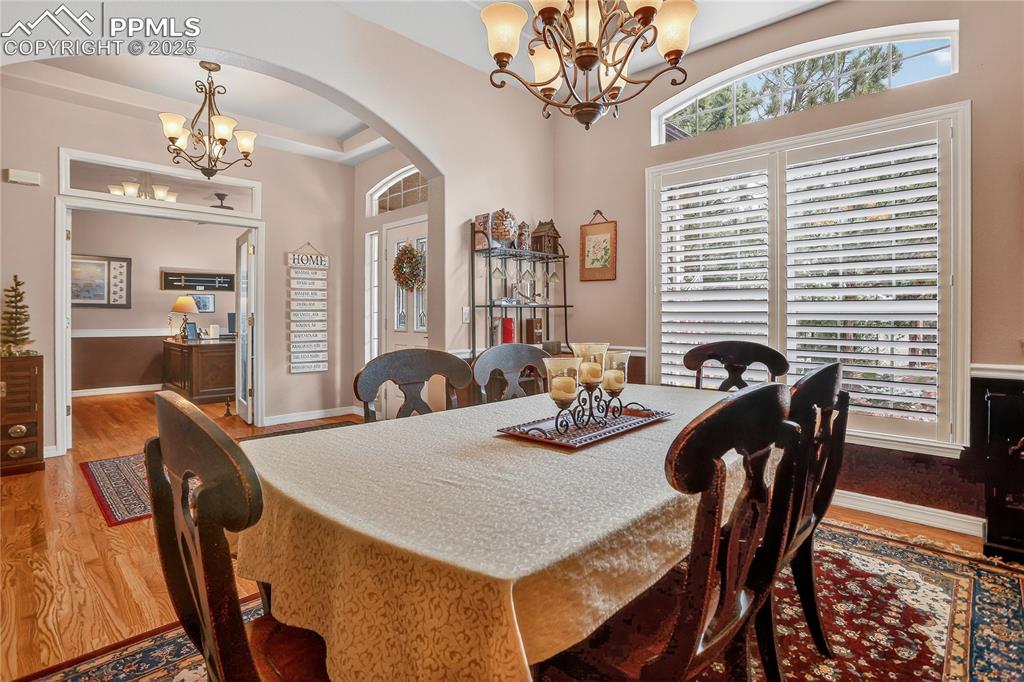 Image 7 of 45: Formal Dining Room with tray ceilings.