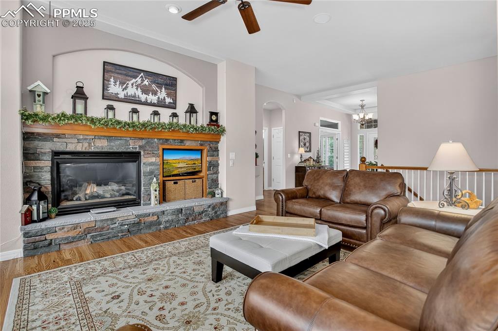 Image 9 of 45: Living room with stone fireplace