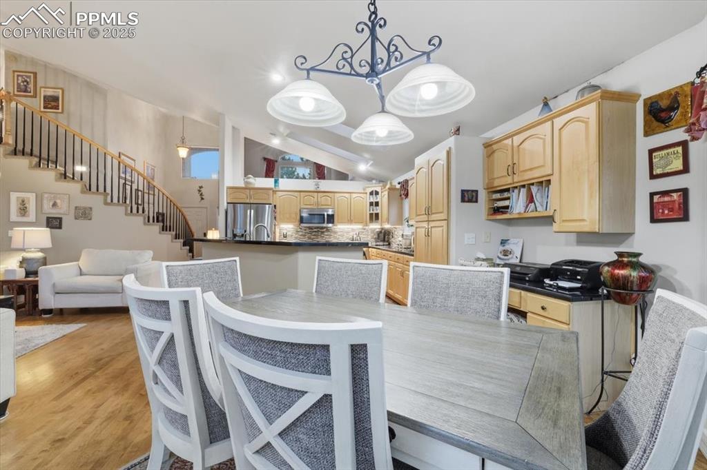 Image 11 of 49: Informal dining area with walk-out onto patio