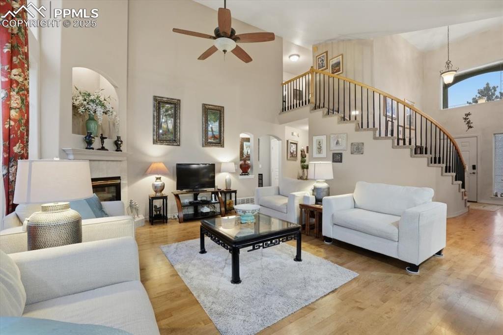Image 13 of 49: Beautiful open living room with walkout onto deck and tons of natural light