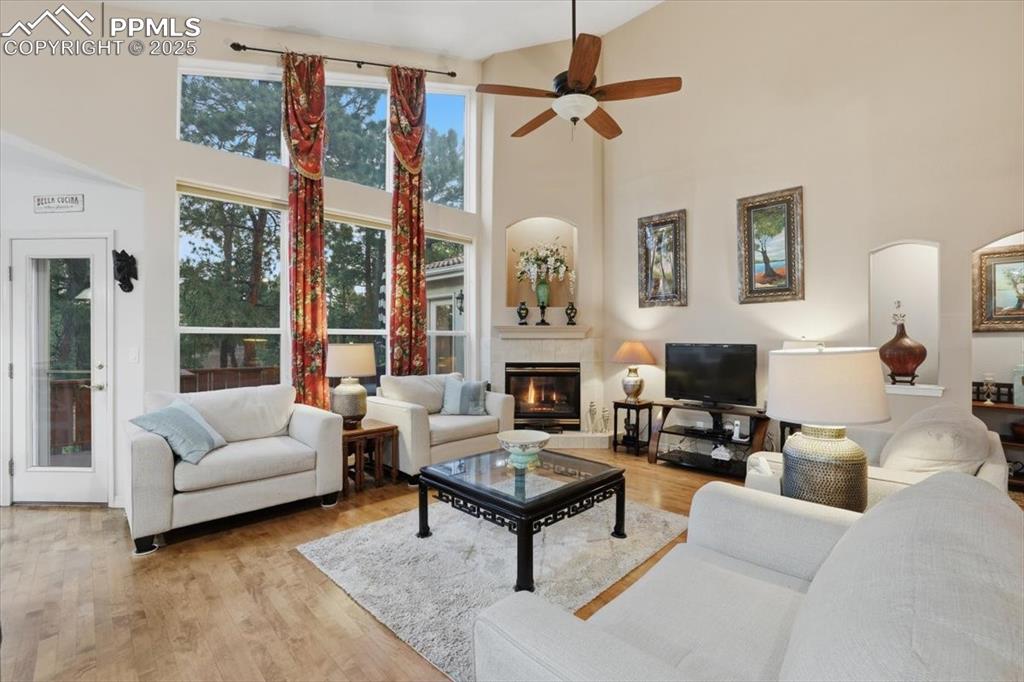 Image 14 of 49: Beautiful open living room with walkout onto deck and tons of natural light