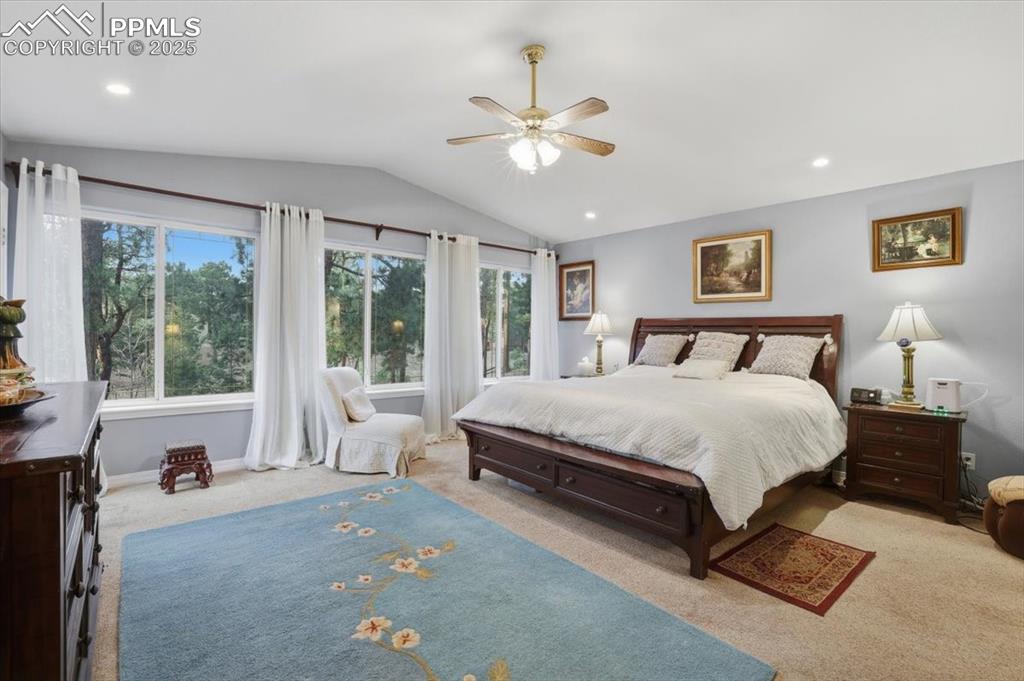 Image 16 of 49: Main level master with en-suite 5 piece bathroom, and walkout on to deck!