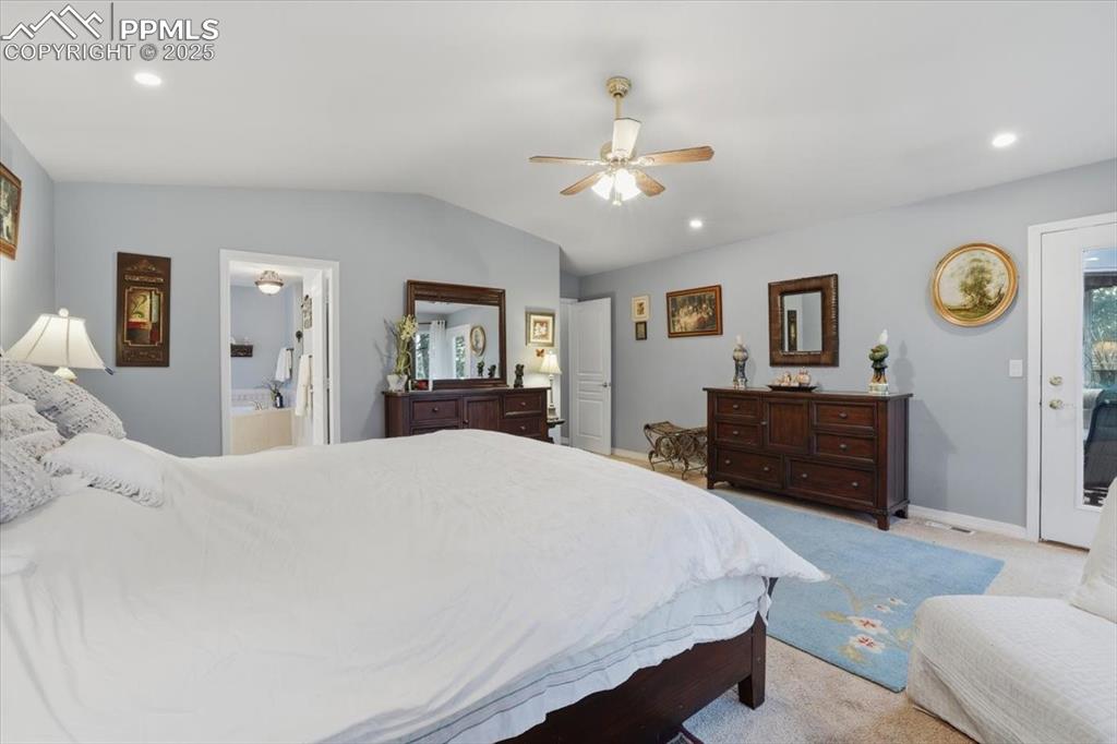 Image 17 of 49: Main level master with en-suite 5 piece bathroom, and walkout on to deck!