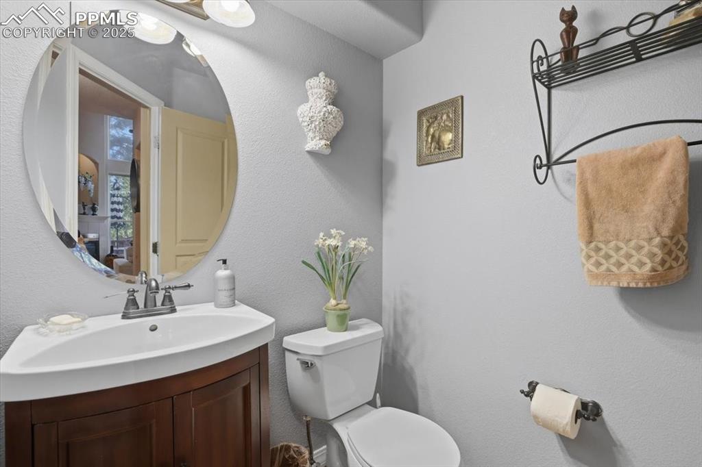 Image 20 of 49: Main floor half bath off of garage entrance