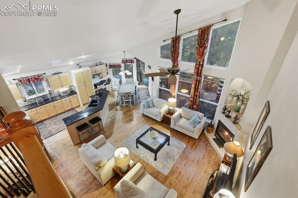 Image 30 of 49: View from upper level onto living room