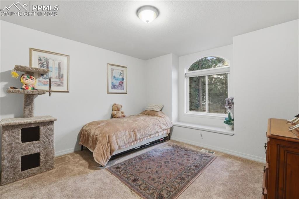 Image 33 of 49: Second upstairs bedroom