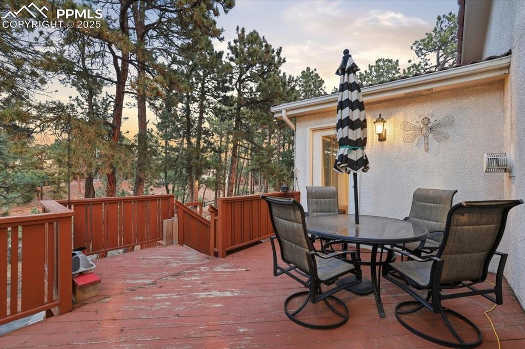 Image 37 of 49: Walk-out back deck from kitchen/master bedroom