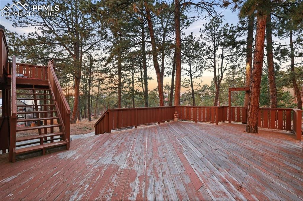 Image 38 of 49: Walk-out back deck from kitchen/master bedroom