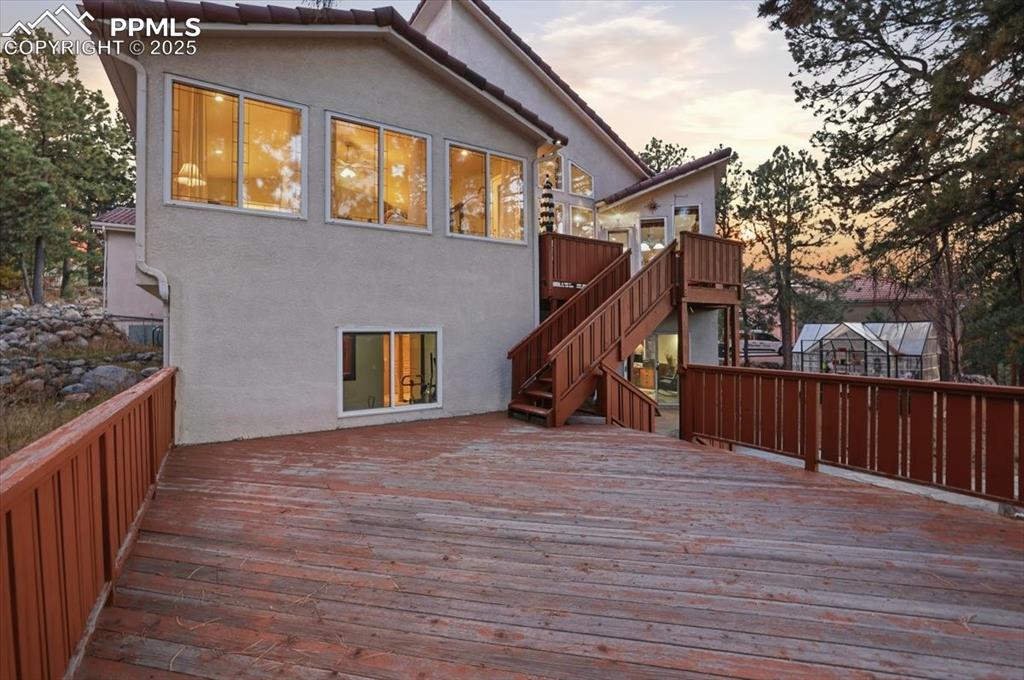 Image 39 of 49: Walk-out back deck from kitchen/master bedroom