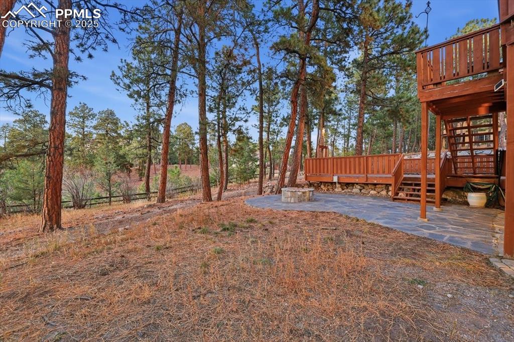 Image 42 of 49: Lower patio off of basement walkout