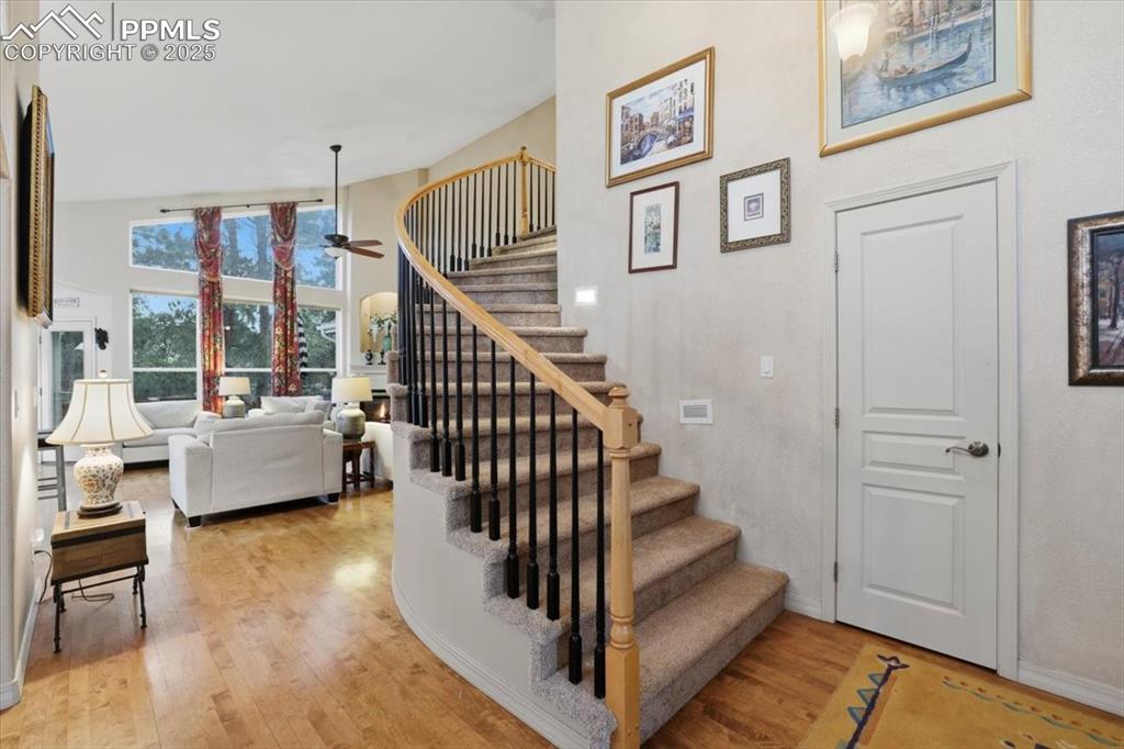 Image 5 of 49: Spiral staircase to upper level off of entryway