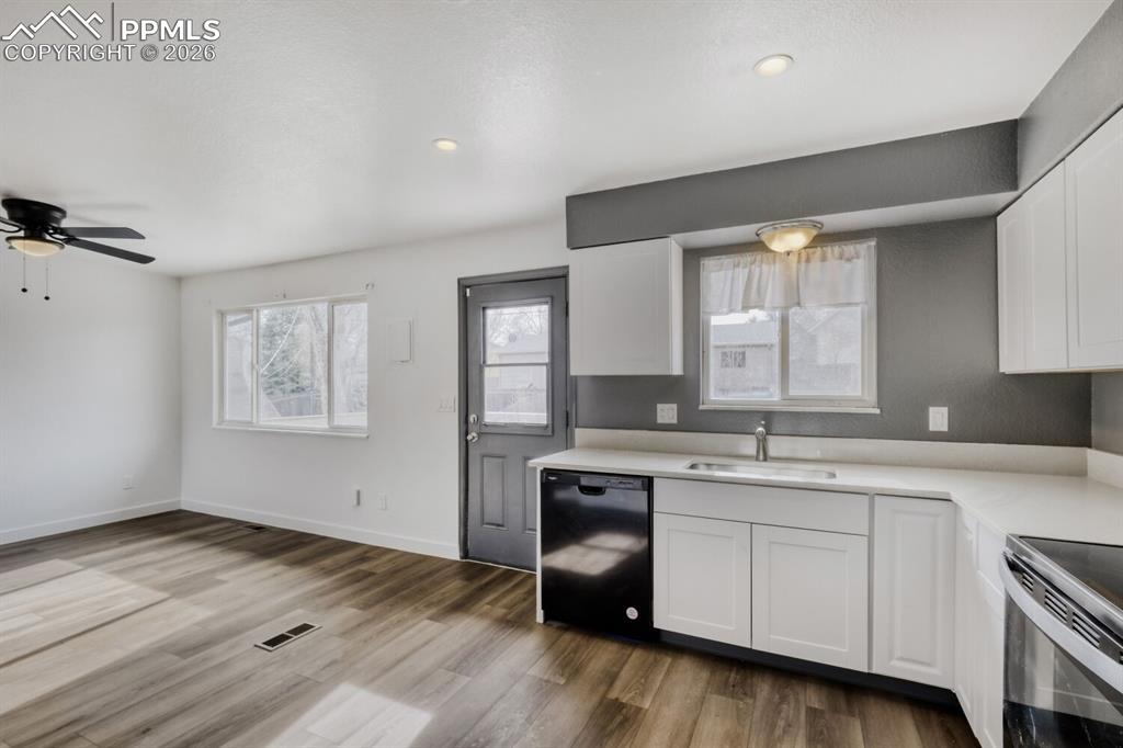 Image 12 of 36: Kitchen with door to back deck