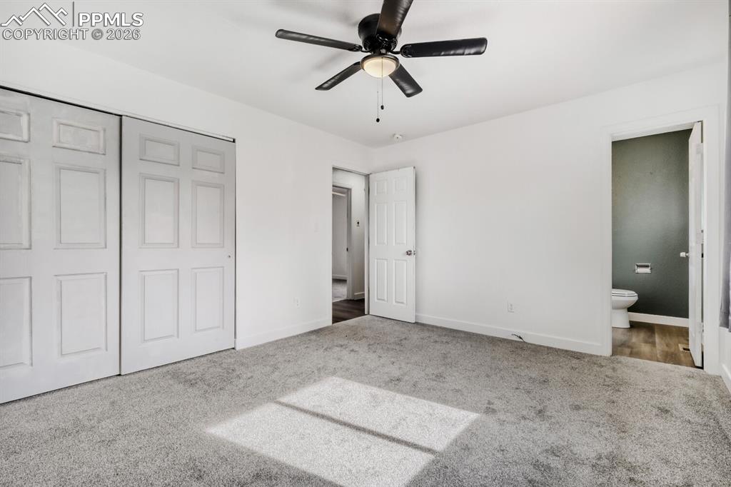 Image 17 of 36: Primary bedroom with en-suite half bathroom