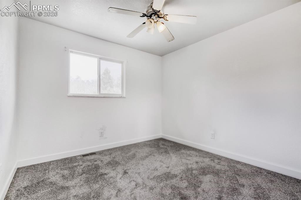 Image 21 of 36: Upstairs second bedroom