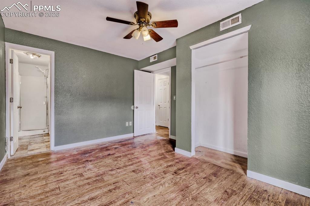 Image 28 of 36: Lower level fifth bedroom with en-suite 3/4 bathroom