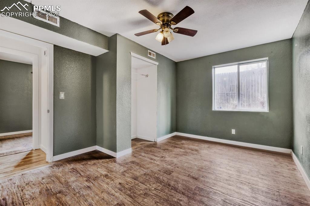 Image 30 of 36: Lower level fifth bedroom with en-suite 3/4 bathroom
