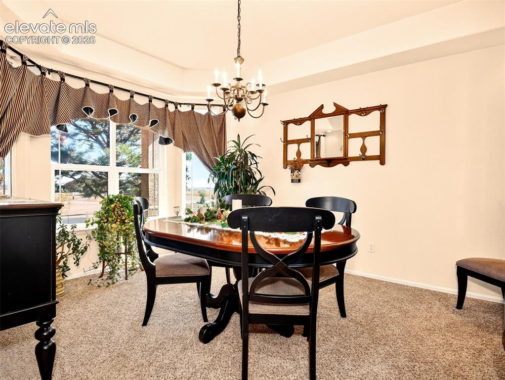 Image 16 of 49: Formal dining room area.