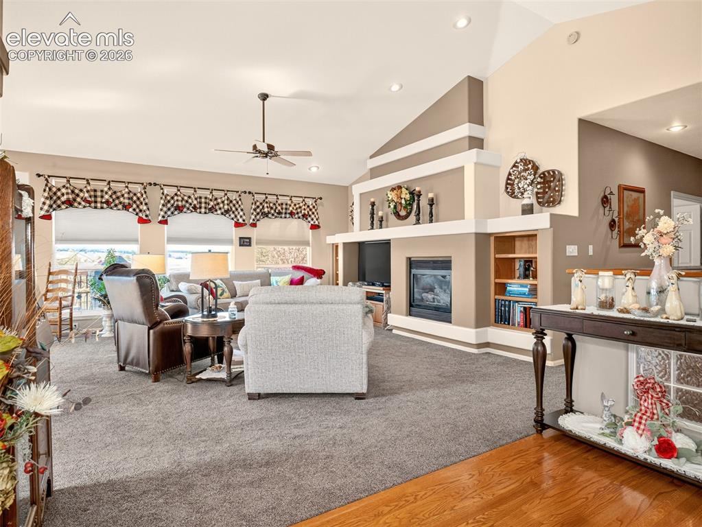 Image 4 of 49: View of living room as you enter the foyer.