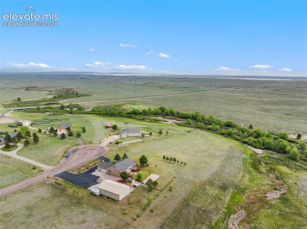 Image 43 of 49: Aerial view of the property with Black Squirrel Creek shown.