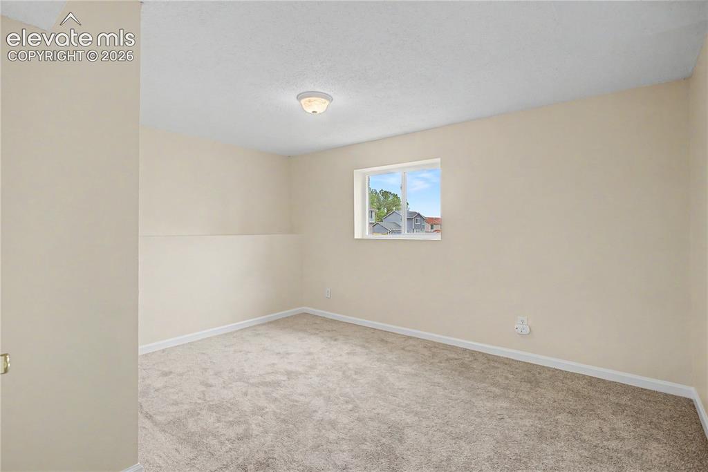 Image 26 of 37: Lower level Living with Gas Fireplace