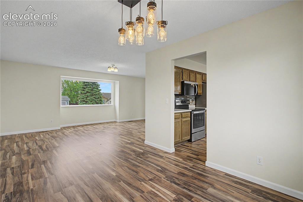 Image 7 of 37: Formal Dining off the kitchen