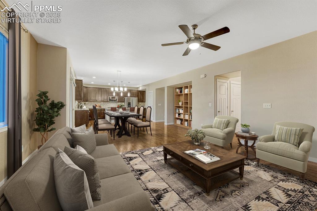 Image 12 of 50: Great room virtually staged.