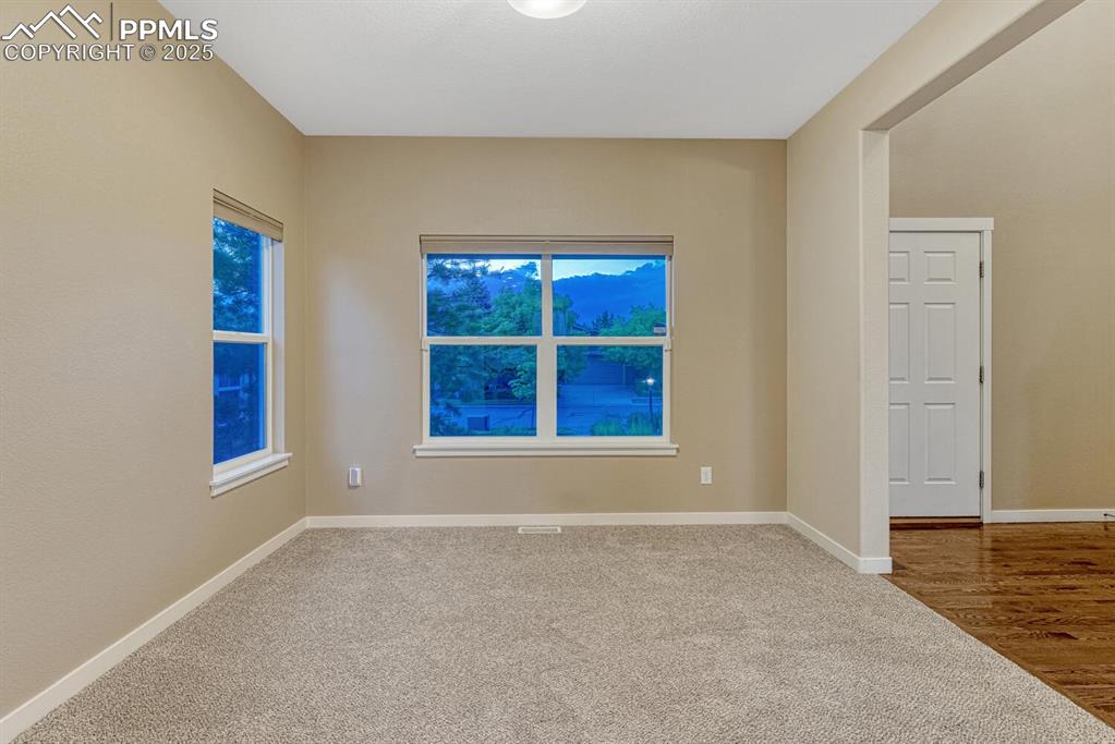 Image 13 of 50: Front room could be a study, sitting room, or formal dining