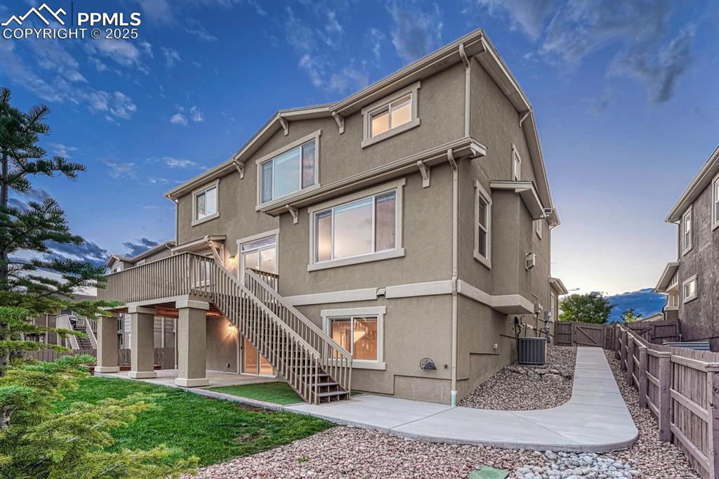 Image 2 of 50: Stucco and stone exterior, mountain views, walk-out basement