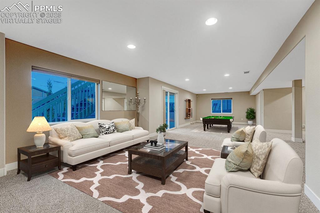 Image 26 of 50: Fully finished walk-out basement. Virtually staged.