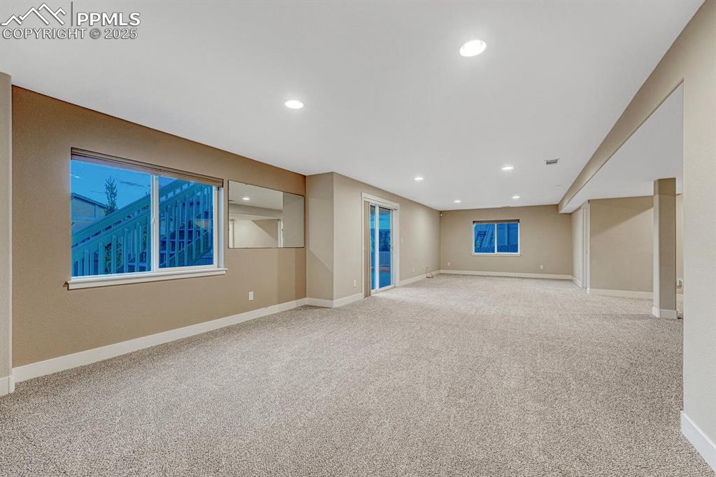 Image 49 of 50: Spare room featuring carpet and recessed lighting