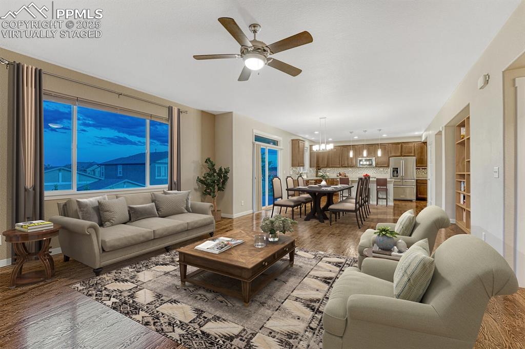 Image 9 of 50: Great room virtually staged.