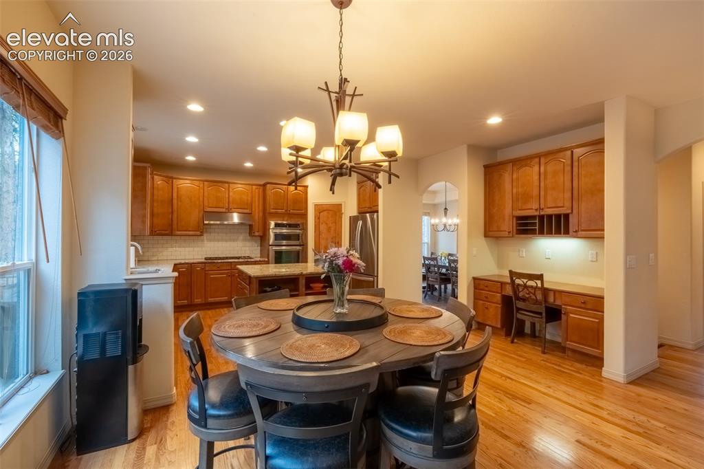 Image 11 of 49: Dining area/kitchen/desk - main floor