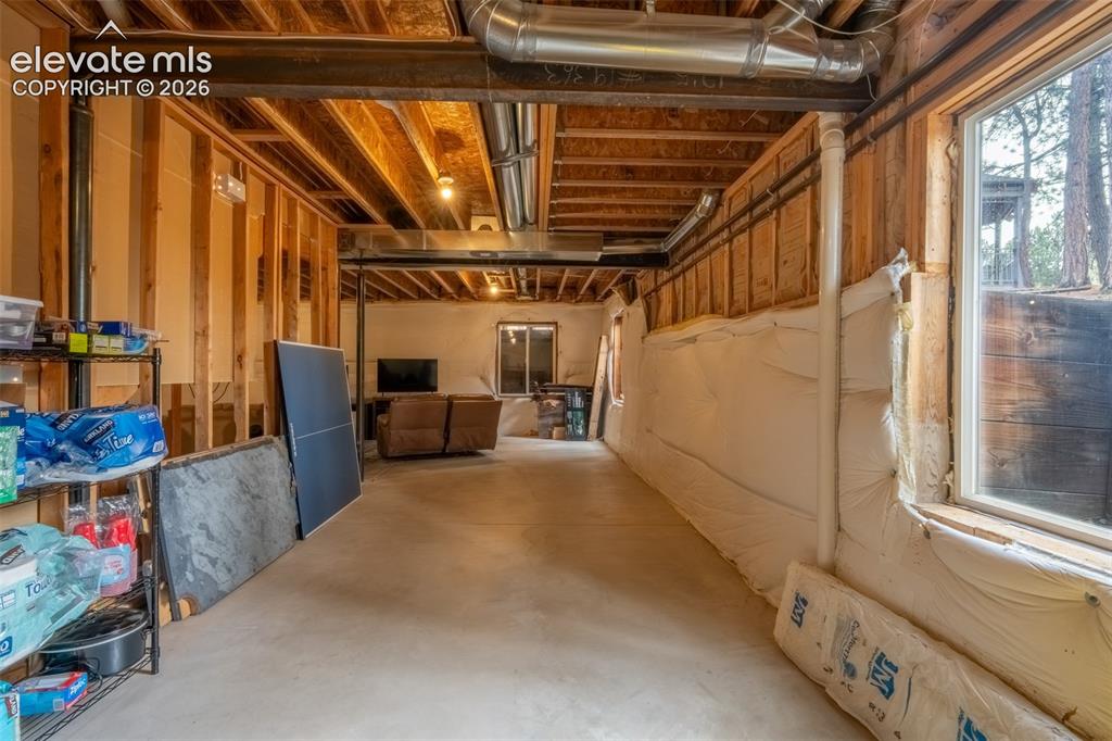 Image 34 of 49: Unfinished nearly 1600 sq ft basement with multiple window egress