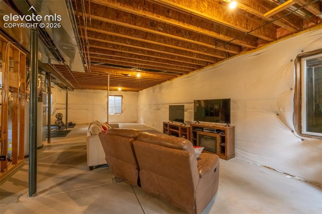 Image 35 of 49: Unfinished nearly 1600 sq ft basement with multiple window egress