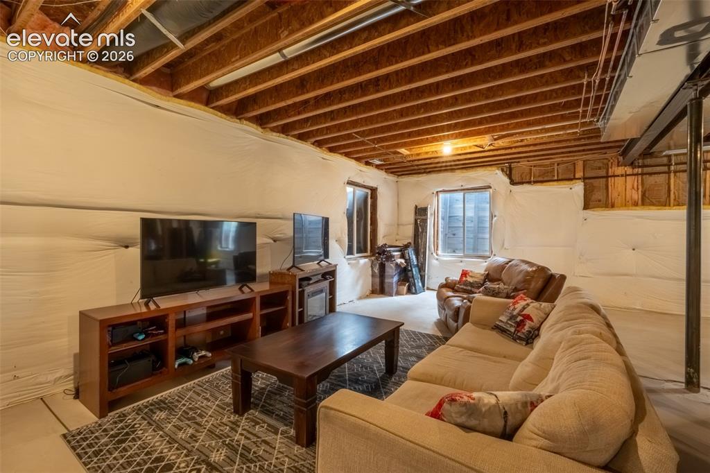 Image 36 of 49: Unfinished nearly 1600 sq ft basement with multiple window egress