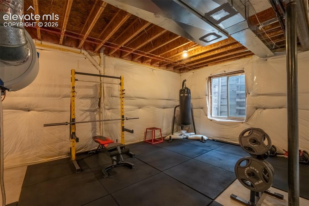 Image 37 of 49: Unfinished nearly 1600 sq ft basement with multiple window egress