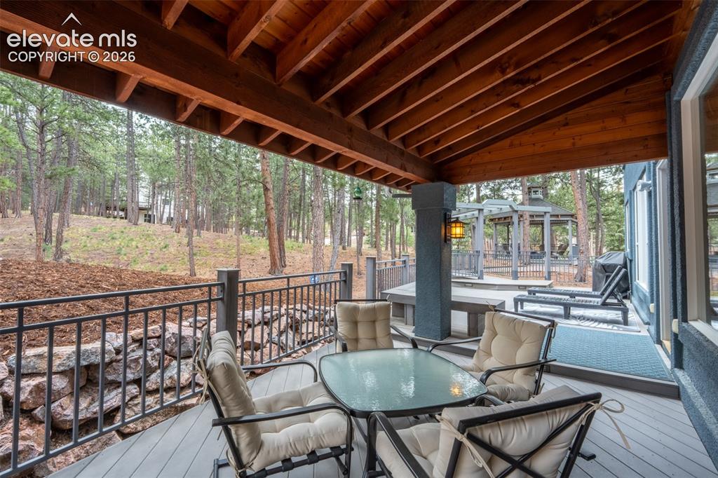 Image 39 of 49: Back deck off living room walk out - half covered/ half uncovered